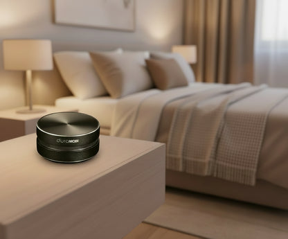 Black circular object with 'duraMOBI' branding on a white background