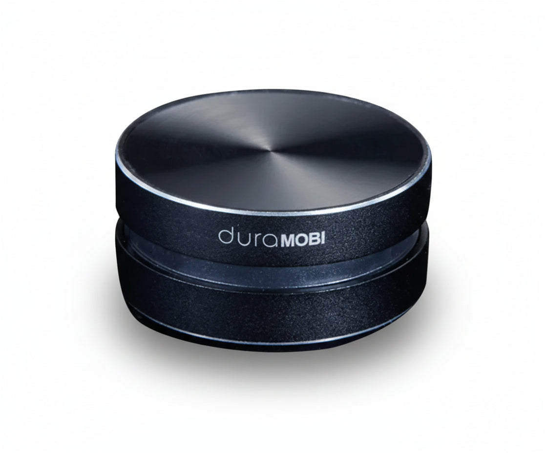 Black circular object with 'duraMOBI' branding on a white background