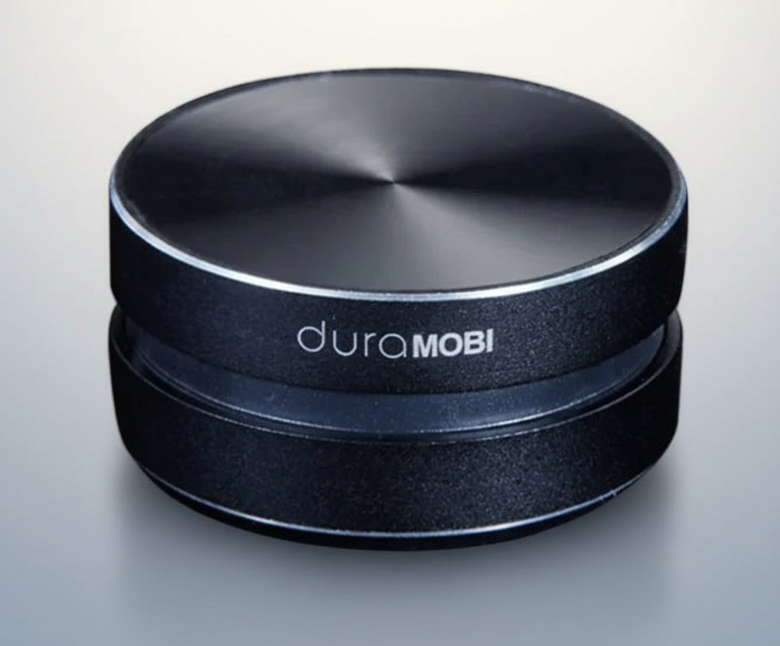 Black circular object with 'duraMOBI' branding on a white background