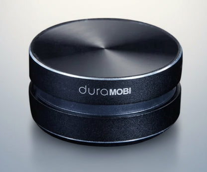 Black circular object with 'duraMOBI' branding on a white background